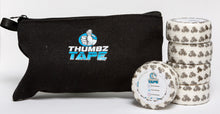 White hook grip tape roll for thumb protection during lifting. Athlete applying thumb tape for Olympic lifting. Thumbz Tape CrossFit hook grip support.