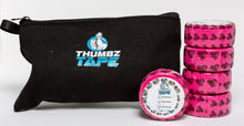 Pink hook grip tape roll for thumb protection during lifting. Athlete applying thumb tape for Olympic lifting. Thumbz Tape CrossFit hook grip support.